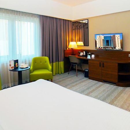 The Grand Lux Hotel 도하 외부 사진 A room at the hotel
